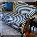 F20. Settee with striped upholstery.